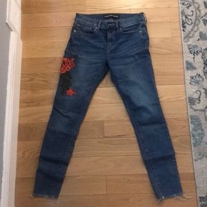 Express jeans with rose embroidered accents